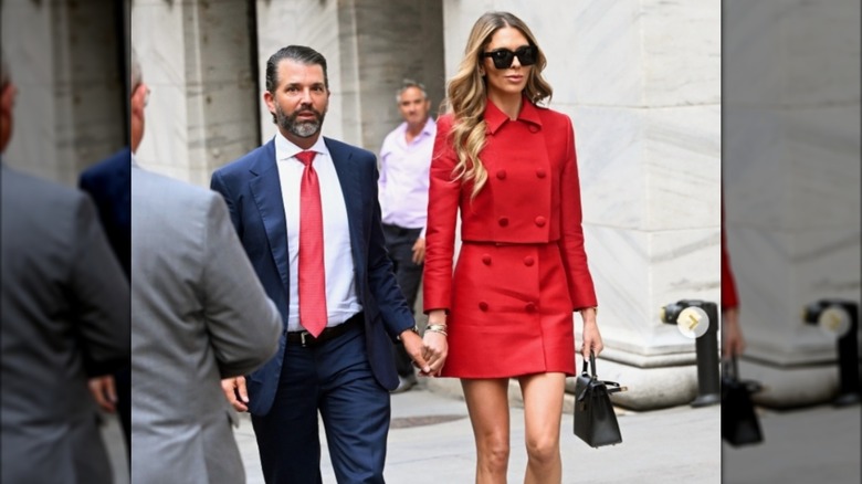 Bettina Anderson wearing a red coat miniskirt with Donald Trump Jr. in New York City.