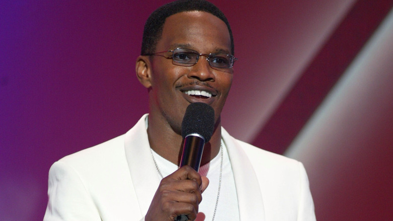Jamie Foxx holding microphone