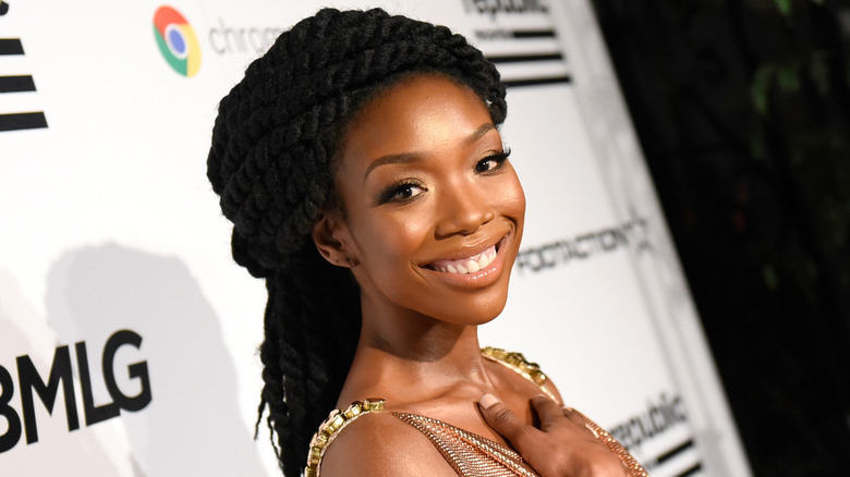 Brandy smiling over shoulder