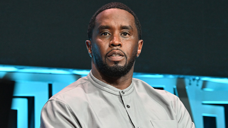 Diddy sitting on stage