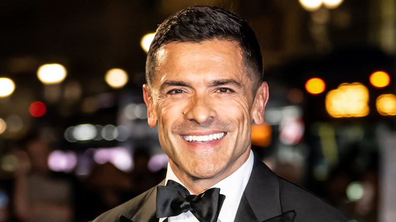 Mark Consuelos posing for cameras in a tuxedo